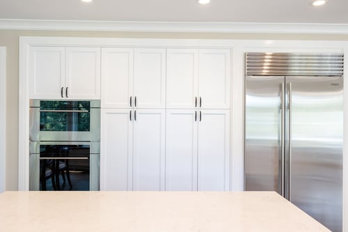 Fridge wall with built-in ovens and white cabinet pull out drawers, VanderBeken Remodel, Mill Creek, 2022-1