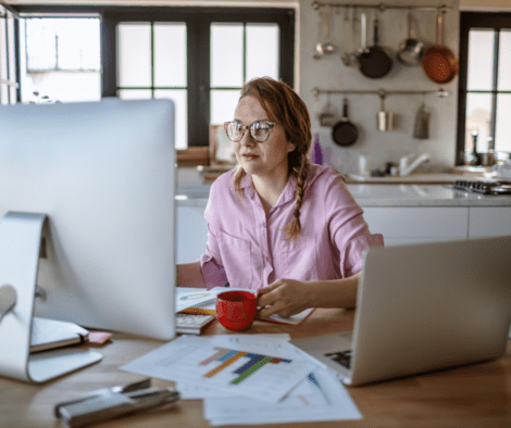 Lady sitting at kitchen table for home office