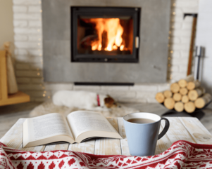 fireplace, open book, & warm drink