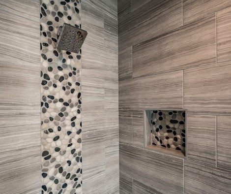 Pebble tile in shower niche
